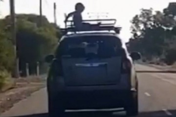 В Австралии мама с ветерком прокатила малыша на крыше крутого внедорожника